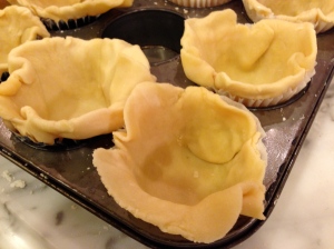 Close-up of mini pie crusts.