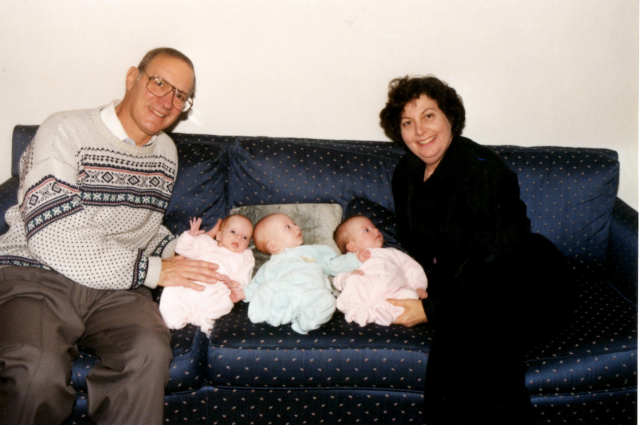 My dad and mom with the triplets.