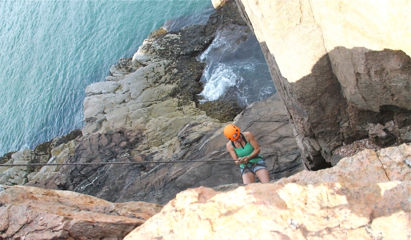 Rappeling down Otter Cliffs, Acadia National Park, Maine.