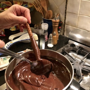 Melt chocolate chips over double boiler.